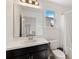 Bathroom featuring white vanity with dark cabinets, bright countertops, and shower with curtain at 5639 Timber Meadow Way, St Cloud, FL 34771