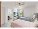 Shared bedroom with two beds, TV and modern furniture, adjoined to a bright bathroom at 5639 Timber Meadow Way, St Cloud, FL 34771