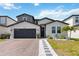 Charming two-story home featuring a brick driveway and beautiful landscaping at 5639 Timber Meadow Way, St Cloud, FL 34771