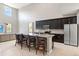 Kitchen island with granite countertops and stainless steel appliances at 5639 Timber Meadow Way, St Cloud, FL 34771