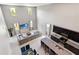 Aerial view highlighting the open layout of the kitchen, living room, and dining area at 5639 Timber Meadow Way, St Cloud, FL 34771