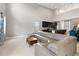 View of open-concept living area with sectional sofa, kitchen, and dining space at 5639 Timber Meadow Way, St Cloud, FL 34771