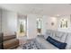 Upstairs landing shows a seating area, doors to a bathroom and bedroom at 5639 Timber Meadow Way, St Cloud, FL 34771