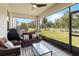 Covered outdoor patio featuring patio furniture, a ceiling fan, and scenic views of the backyard at 5639 Timber Meadow Way, St Cloud, FL 34771
