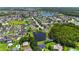A quiet residential community with single-Gathering homes, ponds, and lush greenery and trees at 6005 Coal Ct, St Cloud, FL 34772