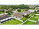 A peaceful backyard with an enclosed patio, beautiful landscaping and white fence is perfect for relaxing at 6005 Coal Ct, St Cloud, FL 34772