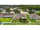 A beautiful backyard with green lawn, a white fence and mature landscaping creating a private oasis at 6005 Coal Ct, St Cloud, FL 34772