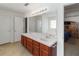 Bright bathroom with double sinks, and a large mirror at 6005 Coal Ct, St Cloud, FL 34772