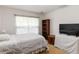 Bedroom with a single bed, a bookshelf, and natural light from the window at 6005 Coal Ct, St Cloud, FL 34772