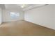 Spacious bedroom boasts neutral carpeting, ample natural light, and a ceiling fan at 6005 Coal Ct, St Cloud, FL 34772