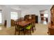 Open-concept dining area with view of multiple rooms, including the kitchen, living room, and foyer at 6005 Coal Ct, St Cloud, FL 34772