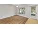 Open dining room features wood-look floors, natural light, and neutral walls at 6005 Coal Ct, St Cloud, FL 34772