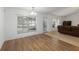 Bright dining room boasts wood-look floors, natural light, and neutral walls at 6005 Coal Ct, St Cloud, FL 34772