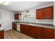 Kitchen features wood cabinets, spacious countertops, and stainless steel sink at 6005 Coal Ct, St Cloud, FL 34772