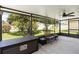 View of the covered patio with a ceiling fan and an outdoor furniture set at 6005 Coal Ct, St Cloud, FL 34772