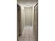Hallway with tile flooring and white trim around the doors at 7104 Blue Earth Ct, Orlando, FL 32818