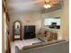 A spacious living room with tile floors, ceiling fan, living room set and view of the kitchen at 7104 Blue Earth Ct, Orlando, FL 32818