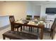 An inviting dining area displays a wood table set with modern tableware and seating for six at 7172 Sw 135Th Pl, Ocala, FL 34473
