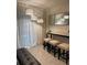Dining area featuring bar-stool seating, pendant lighting and a console table at 7172 Sw 135Th Pl, Ocala, FL 34473