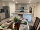 Eat-in kitchen featuring gray cabinets, granite countertops, and stainless steel appliances at 7172 Sw 135Th Pl, Ocala, FL 34473