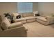 Comfortable living room featuring a sectional sofa, and cozy decor at 7172 Sw 135Th Pl, Ocala, FL 34473
