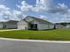 Single-story home with a manicured lawn, two car garage, and neatly trimmed landscaping at 7172 Sw 135Th Pl, Ocala, FL 34473