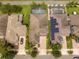 Aerial view of homes with brick driveways and palm trees at 7214 Tattant Blvd, Windermere, FL 34786