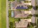 Aerial view of homes with screened pools and solar panels on the roofs at 7214 Tattant Blvd, Windermere, FL 34786