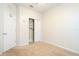 Neutral carpeted bedroom featuring a closet, white walls, and an abundance of natural light at 7214 Tattant Blvd, Windermere, FL 34786
