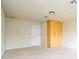 Carpeted bonus room with a closet, door and window with lots of space for recreation or additional storage at 7214 Tattant Blvd, Windermere, FL 34786