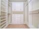 Well-organized walk-in closet with ample shelving and drawer space at 7214 Tattant Blvd, Windermere, FL 34786
