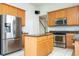 Well-equipped kitchen with stainless steel appliances, granite countertops, and an island at 7214 Tattant Blvd, Windermere, FL 34786