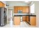 Well-lit kitchen featuring stainless steel appliances, granite countertops, and ample cabinet space at 7214 Tattant Blvd, Windermere, FL 34786