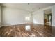 Bright living room featuring hardwood floors, large windows, and an open floor plan at 7214 Tattant Blvd, Windermere, FL 34786