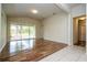 Bright living room with hardwood floors and sliding glass doors to the patio at 7214 Tattant Blvd, Windermere, FL 34786
