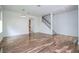 Spacious living room features hardwood floors, staircase, and access to other rooms at 7214 Tattant Blvd, Windermere, FL 34786