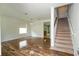 Bright living room with hardwood floors, a staircase, and an open layout at 7214 Tattant Blvd, Windermere, FL 34786