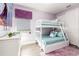 bedroom with bunk beds, cartoon mural, dresser and pastel colors at 884 Golden Bear Dr, Reunion, FL 34747
