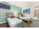 Charming bedroom with twin beds, nautical decor and stylish furnishings at 884 Golden Bear Dr, Reunion, FL 34747