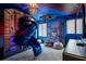 Star Wars themed ' bedroom with slide, spaceship model, and custom wall art at 884 Golden Bear Dr, Reunion, FL 34747