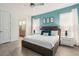 A bedroom with an en-suite bathroom has a ceiling fan, tiled floors, and minimal decor at 884 Golden Bear Dr, Reunion, FL 34747