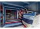 Close-up shot inside Star Wars themed bunk bed with custom wall art and a striped quilt at 884 Golden Bear Dr, Reunion, FL 34747