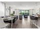 Elegant dining room with a formal table setting, contemporary decor, and an open layout leading to the inviting living area at 884 Golden Bear Dr, Reunion, FL 34747