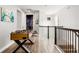 This hallway features a foosball table, railings, and a view into the Star Wars themed bedroom at 884 Golden Bear Dr, Reunion, FL 34747