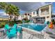 Backyard pool features an attached spa, patio, and outdoor furniture, creating a resort-style oasis at 884 Golden Bear Dr, Reunion, FL 34747