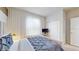 Bedroom featuring neutral decor and a large window offering ample natural light at 8900 Sydney Ave, Kissimmee, FL 34747