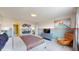 Inviting bedroom with contemporary design, comfortable seating, and warm lighting at 8900 Sydney Ave, Kissimmee, FL 34747
