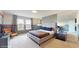 Modern bedroom with neutral colors, sleek furniture, and ample natural light at 8900 Sydney Ave, Kissimmee, FL 34747