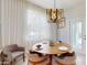 Elegant dining room featuring modern lighting fixture and inviting dining space at 8900 Sydney Ave, Kissimmee, FL 34747