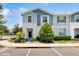 Charming two-story townhome featuring a well-maintained lawn and inviting front entrance at 8900 Sydney Ave, Kissimmee, FL 34747